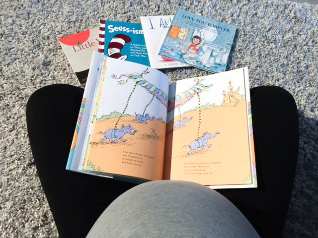 Expecting mama reading Dr. Seuss