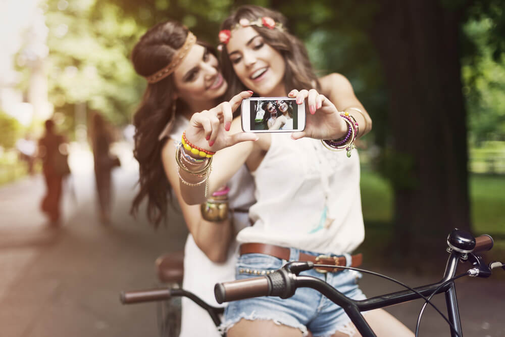 Teenagers taking selfie