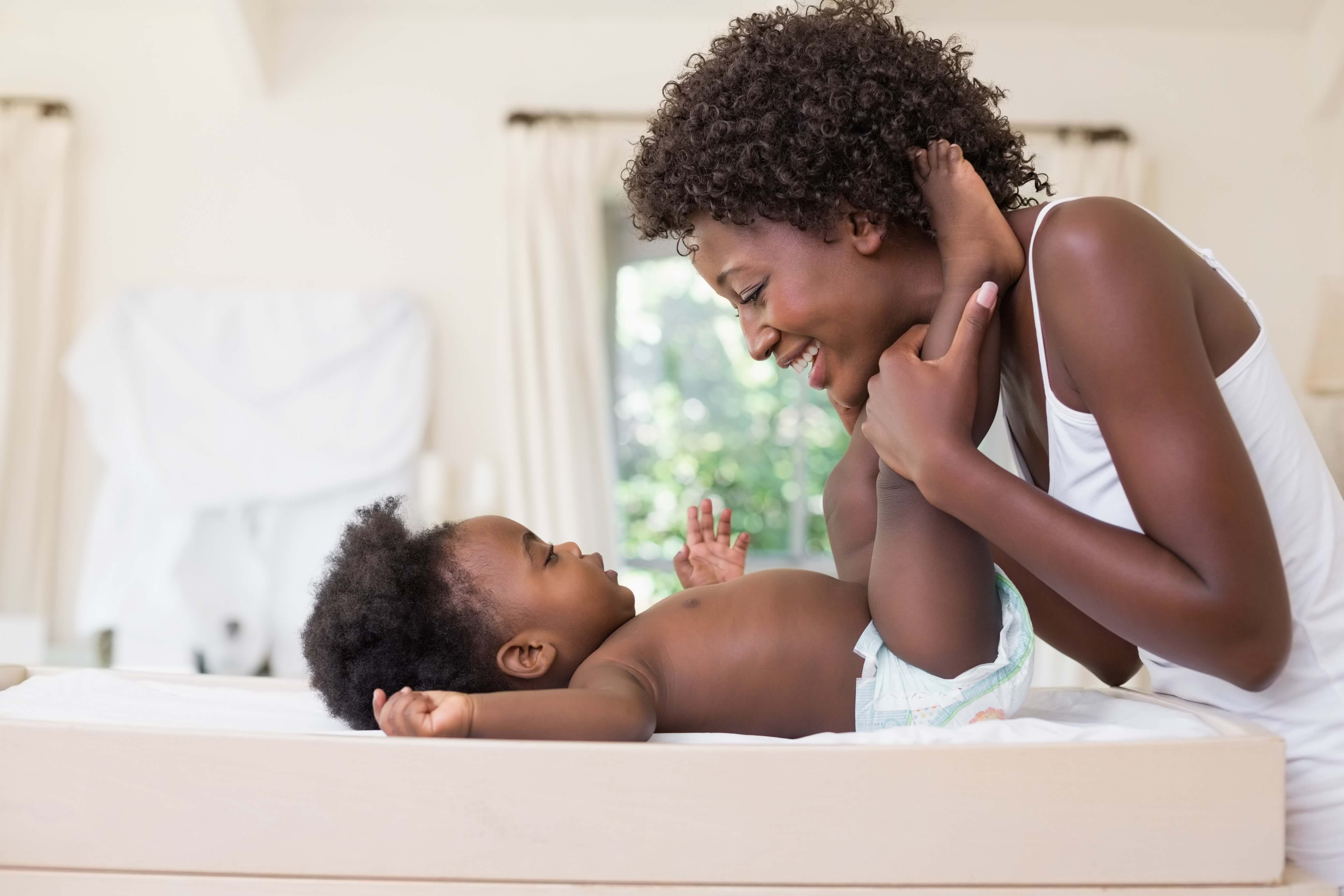 Picture of mom playing with baby