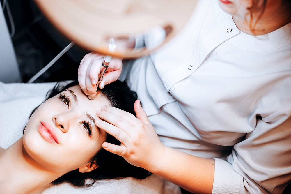 Lady getting micro-needling on her face