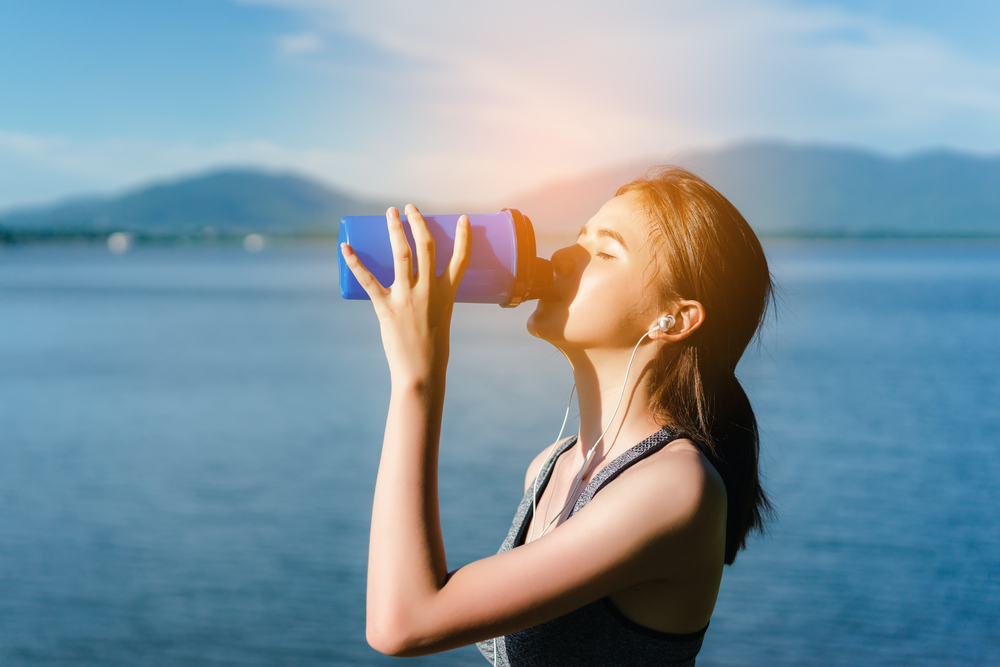 woman drinking a protein shake