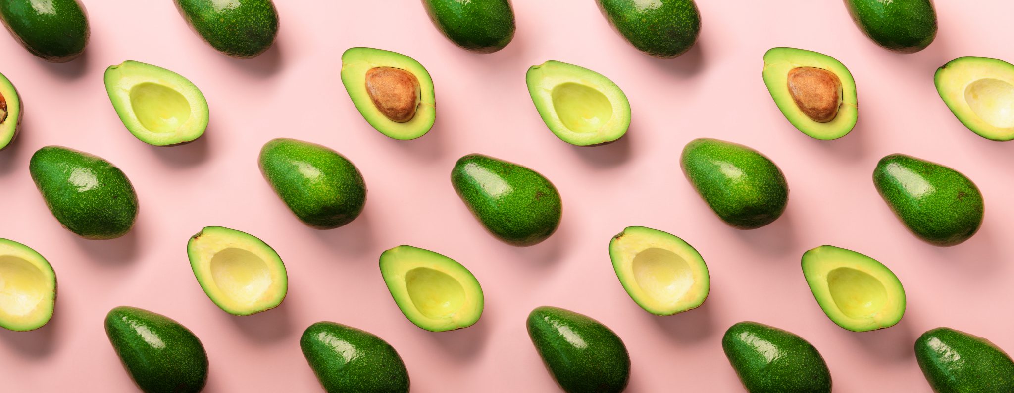 avocados on a pink background