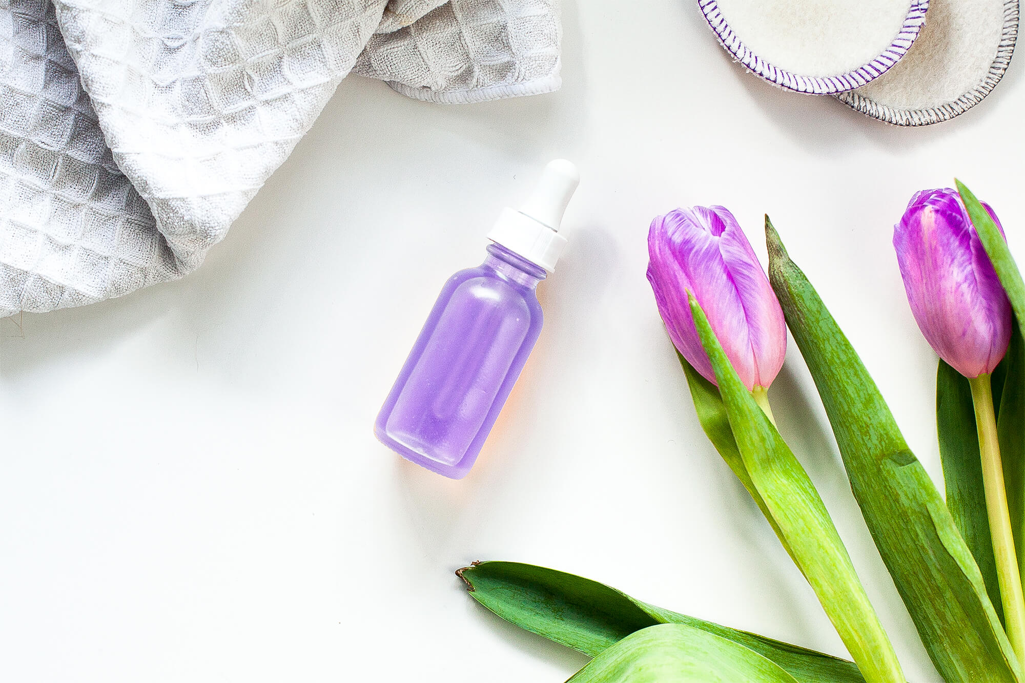purple serum and purple tulips