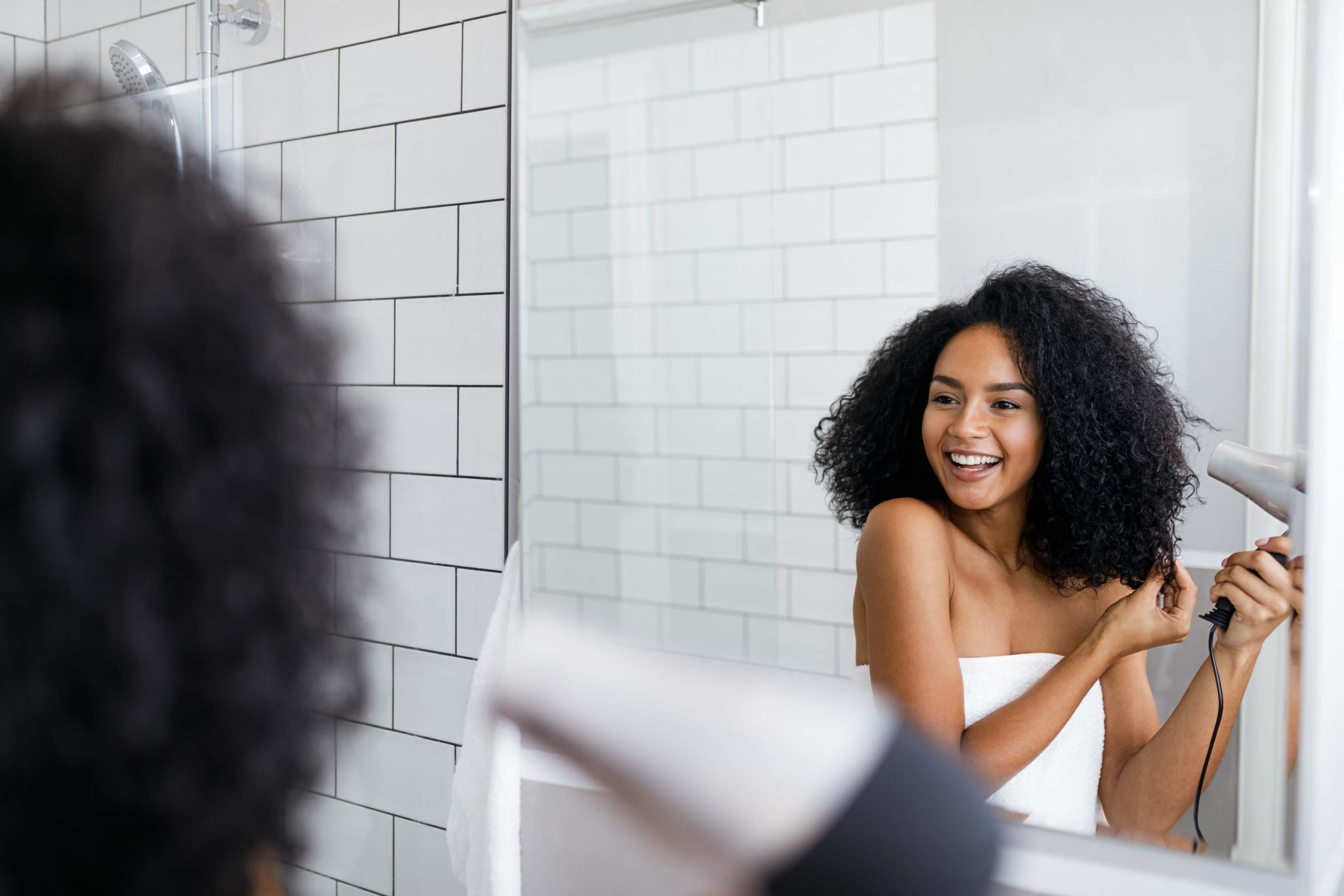 girl styling curly hair