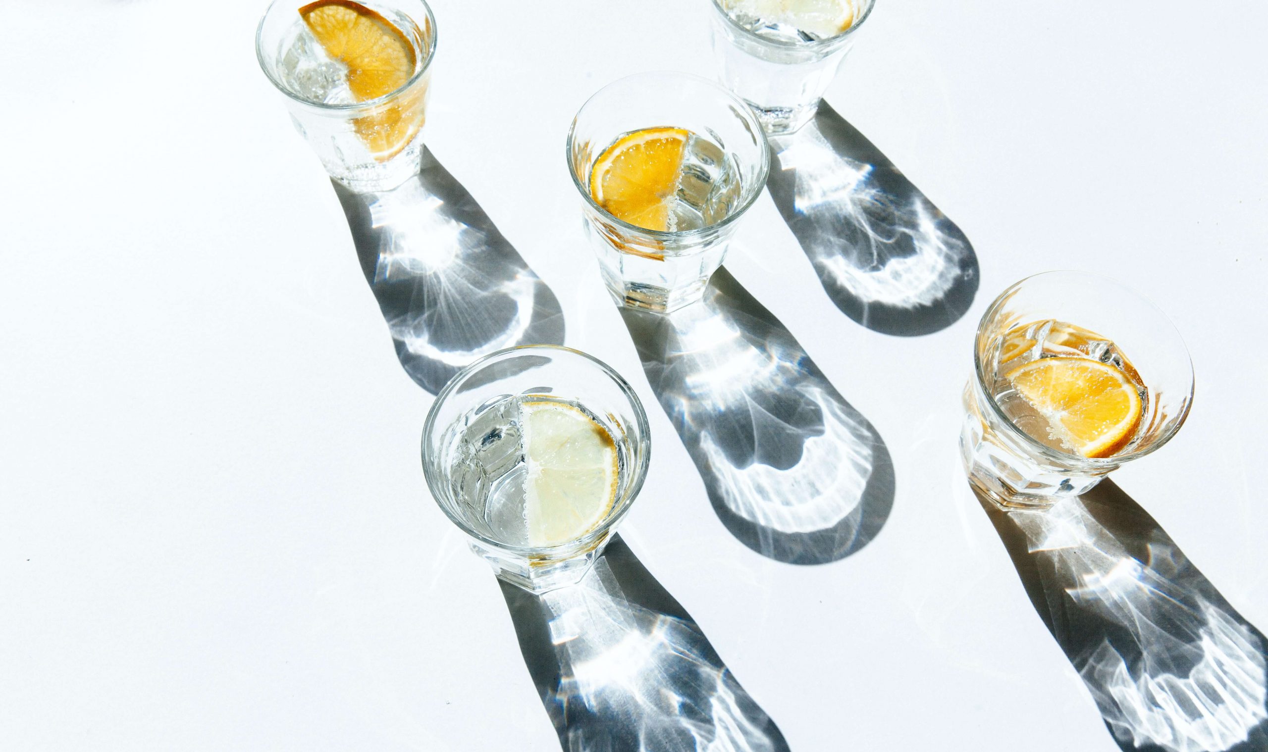 5 glasses of water with Lemon slices