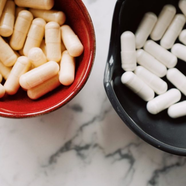 marine and bovine collagen capsules in 2 bowls