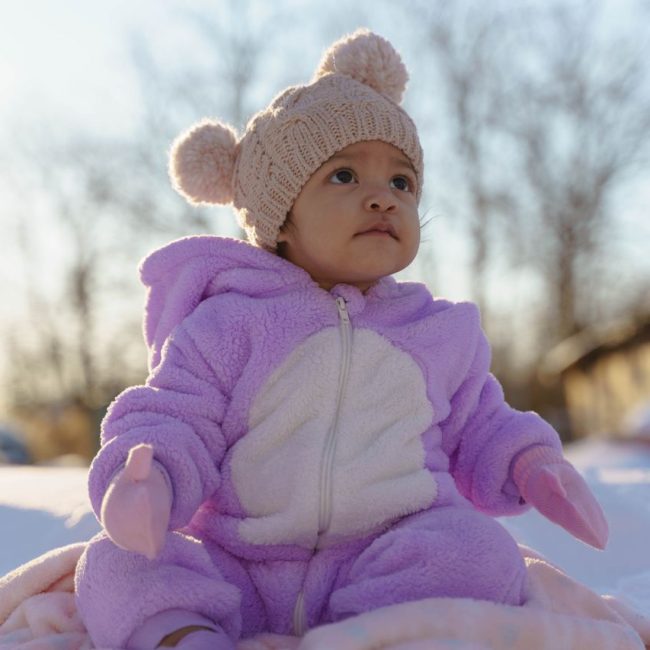 baby in pink fleece winter suit and hat