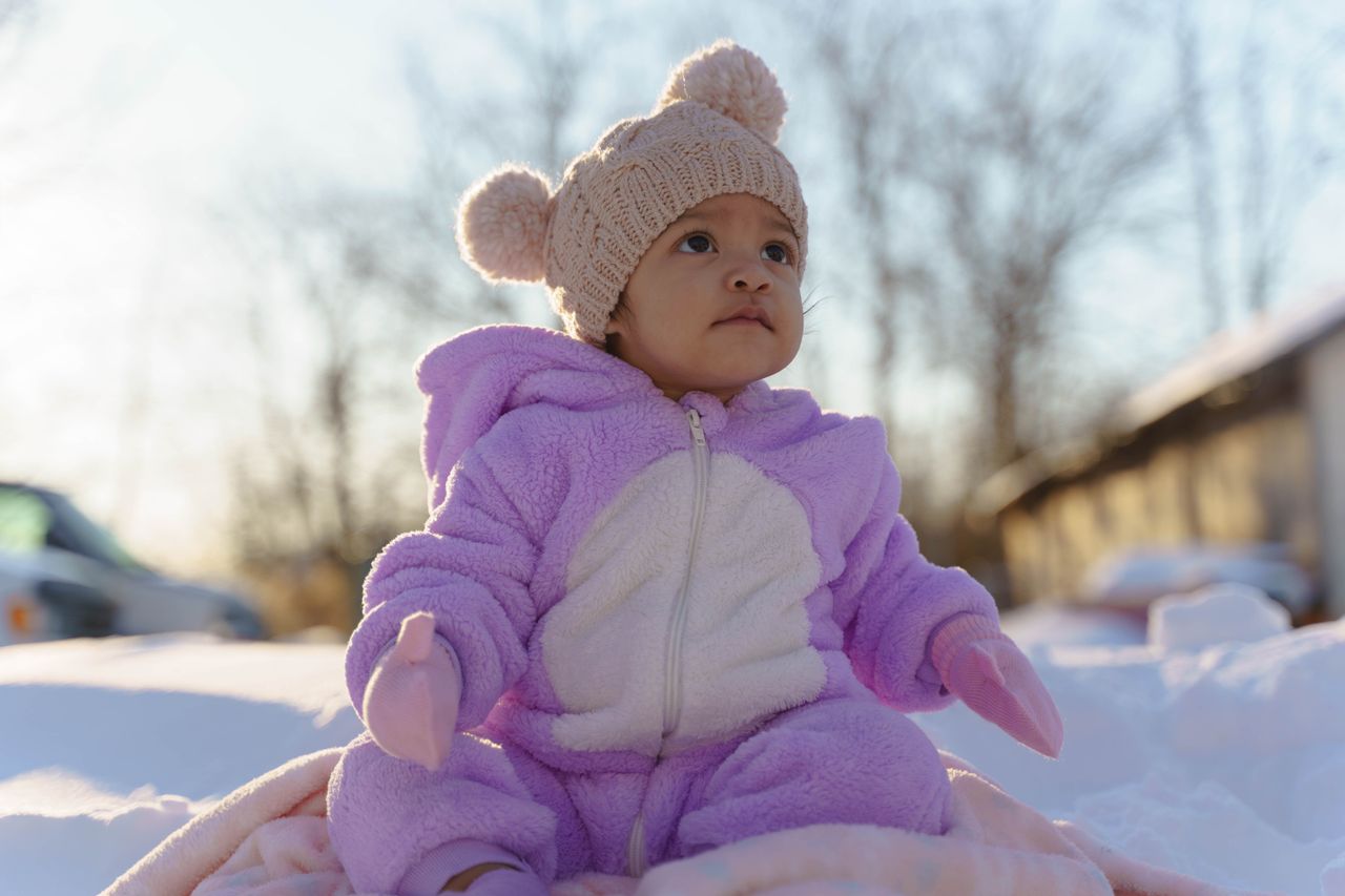 baby in pink fleece winter suit and hat